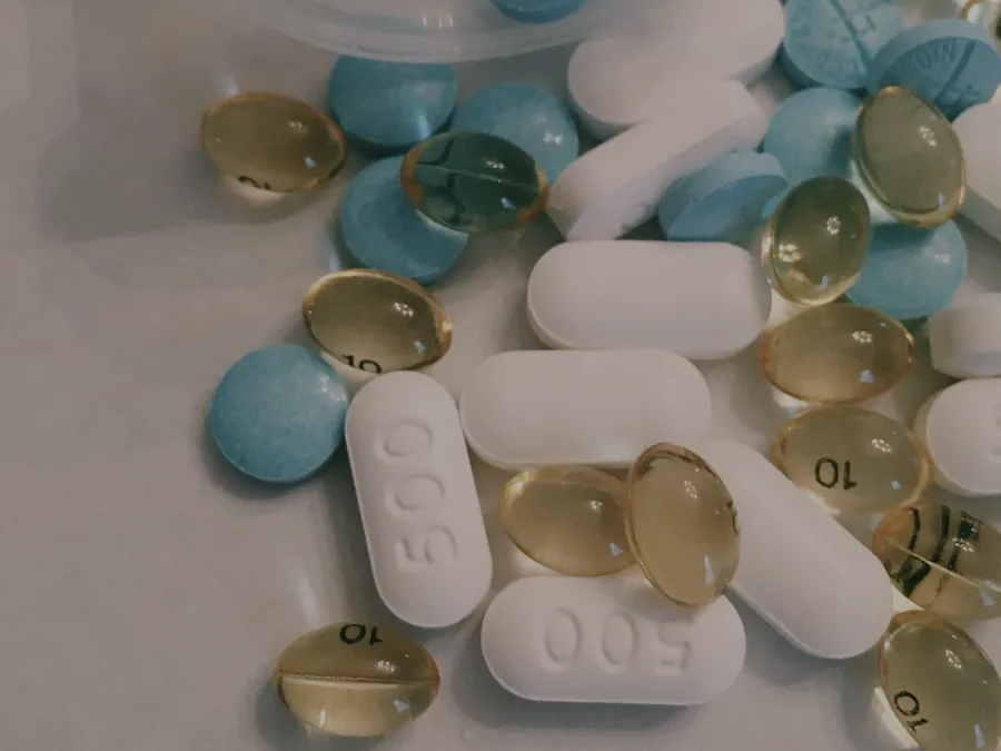 An assortment of vitamin tablets and supplement capsules